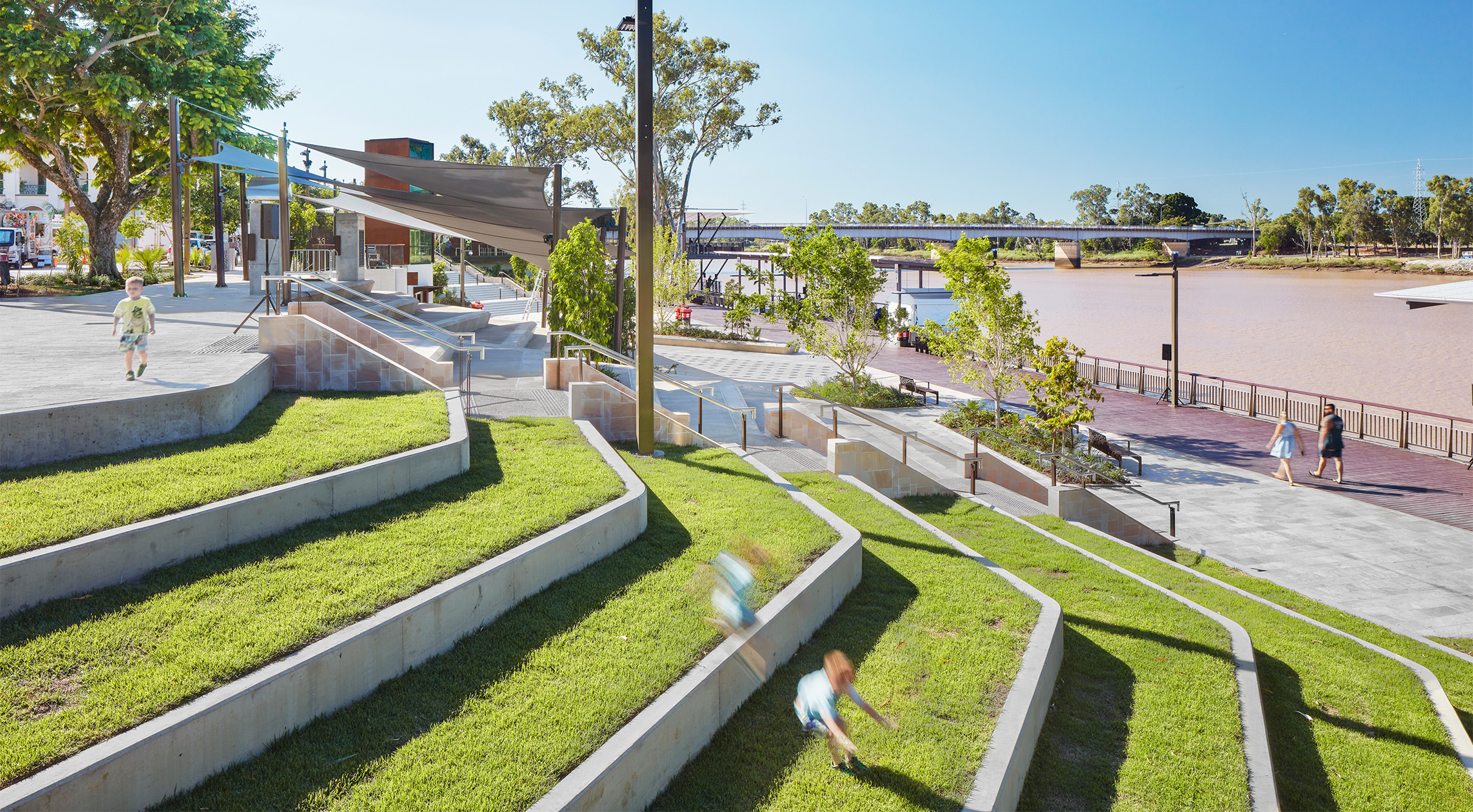 A layered public realm from street level to the river