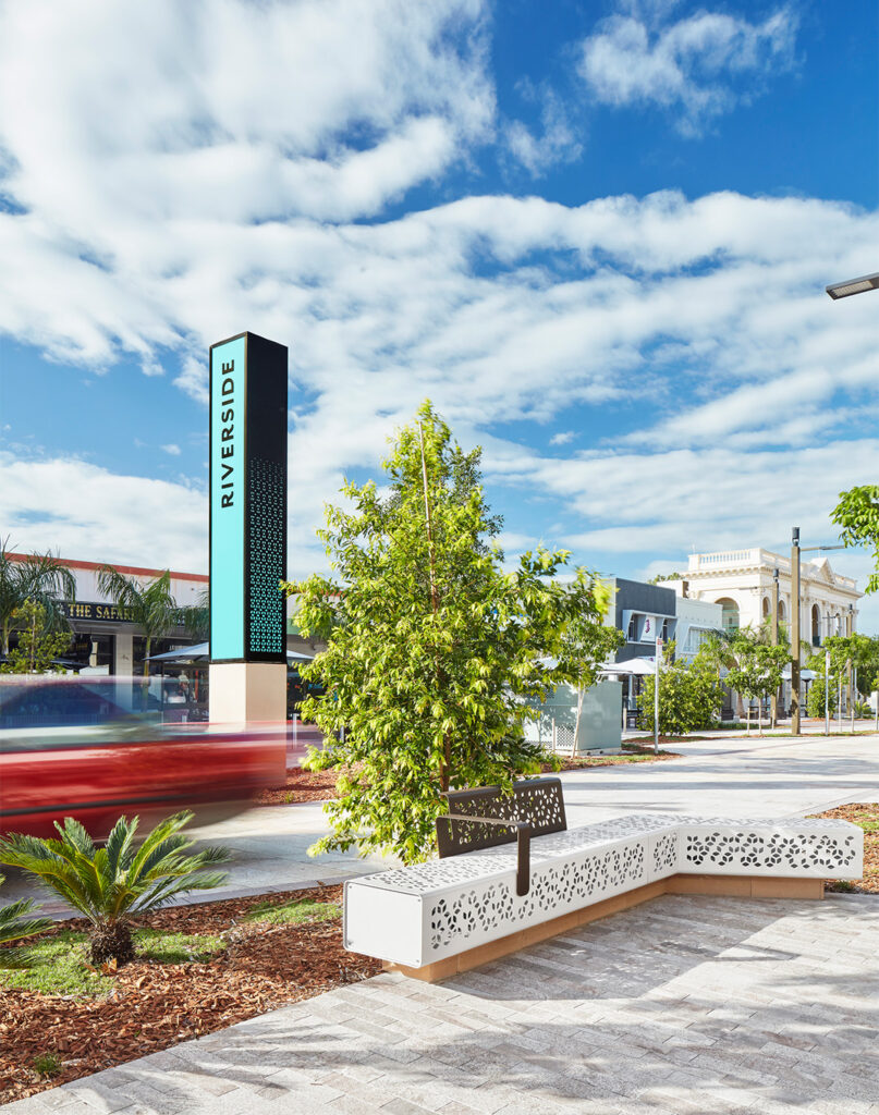 The wayfinding takes design cues from the street furniture to create a cohesive space