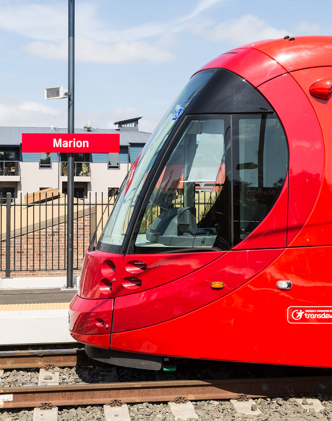 The wayfinding coordinates with the red brand colour of the light rail network