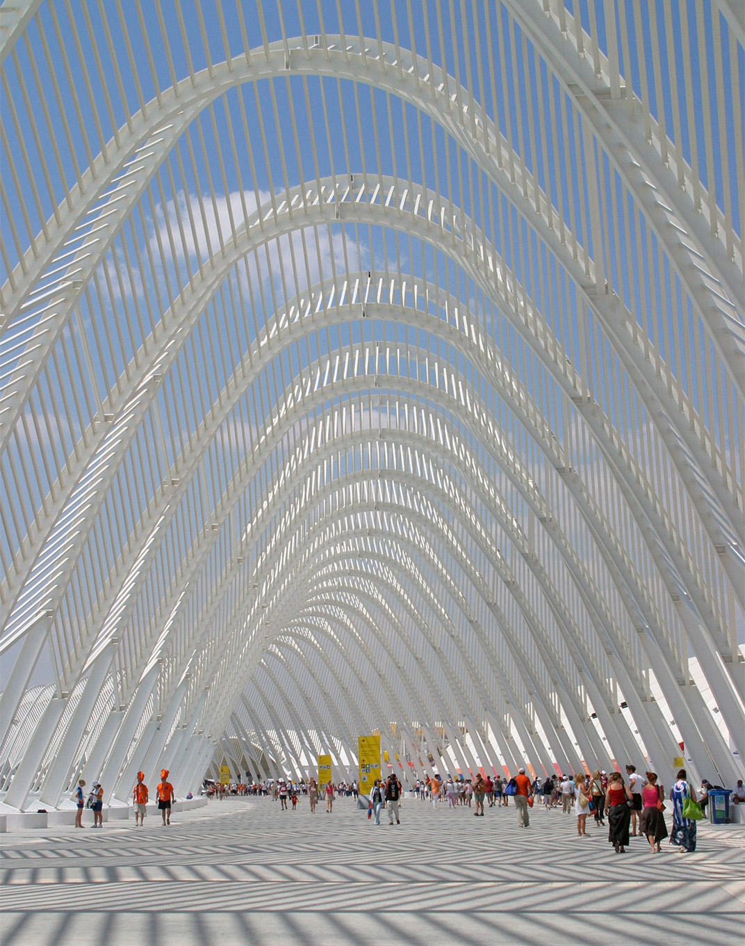 Yellow signage on architectural bridge at 2004 Athens Olympics