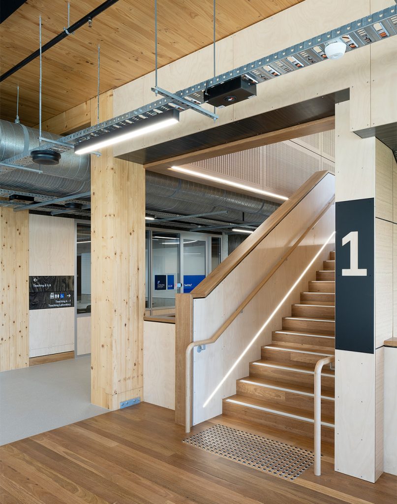 Level ID sign in the foreground, with directional wayfinding in the background.