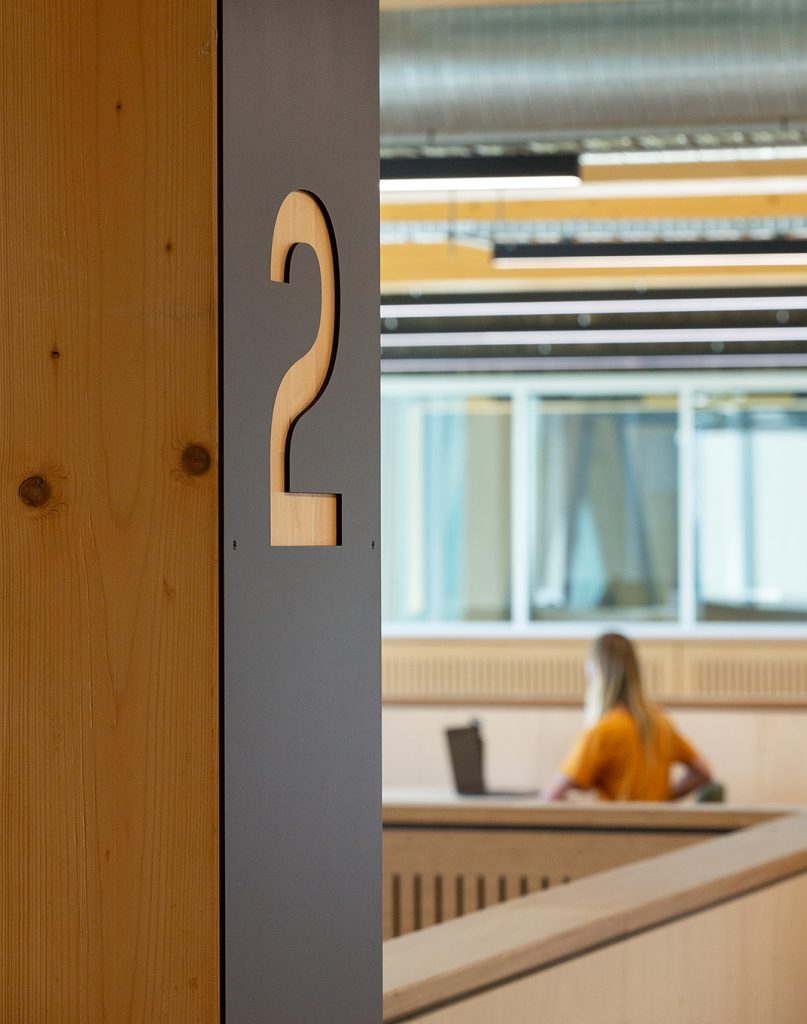 A close up detail of the cut-out level ID signage.